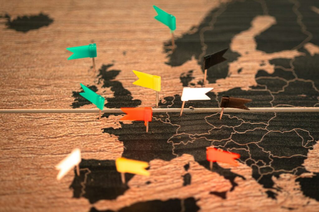 A map of the world with pins pointing in different directions