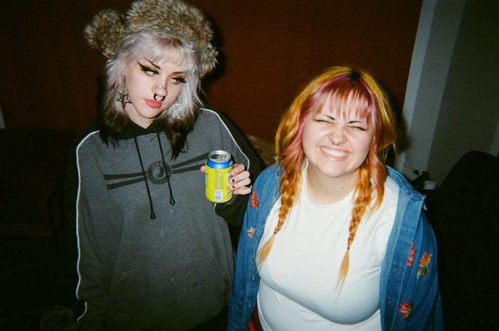 A couple of women standing next to each other