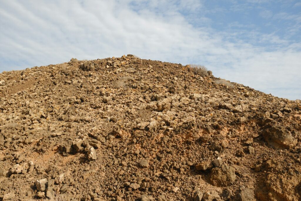 A large pile of dirt sitting on top of a hill