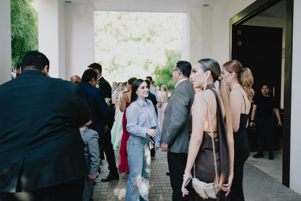 People gather at an outdoor event entrance