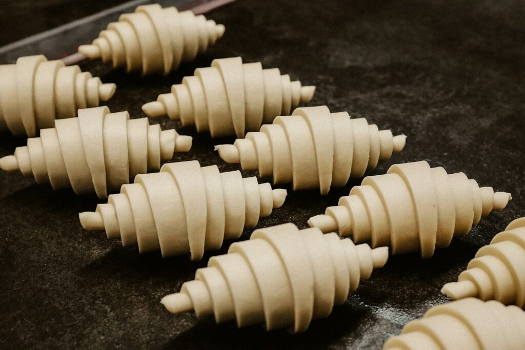 a close up of a number of doughs on a tray