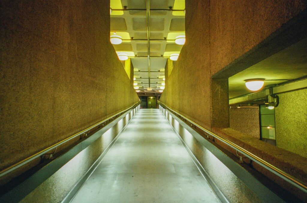 Illuminated modern walkway with textured walls to illustrate Trump's bunker