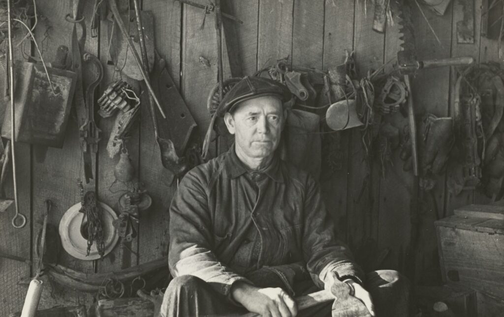 Pioneer man sitting in his workshop