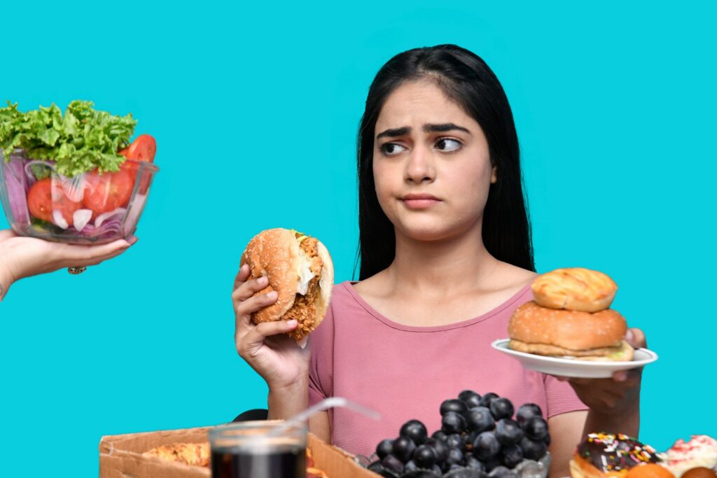 a woman eating a bowl of fruit