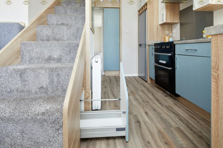brown wooden staircase near white wooden door