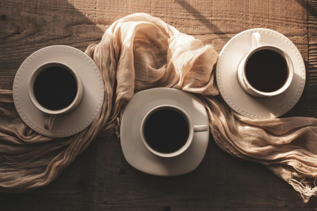 three cups of coffee are sitting on a table