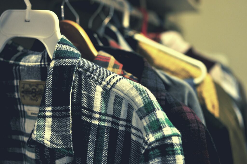a row of shirts hanging on a rack