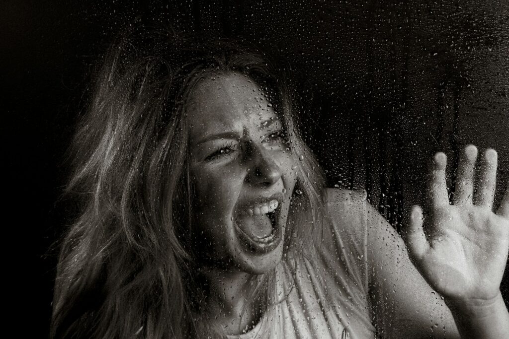 A woman screams in horror.