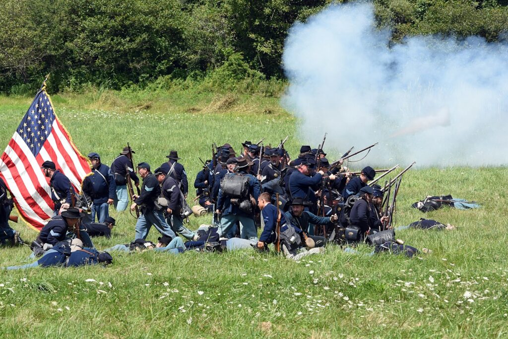 Revolutionary war soldiers with USA flag reenactment